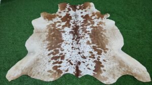 brown white cowhide rug