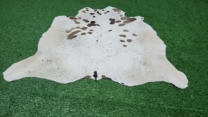 white brown cowhide rug