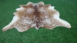 brown white cowhide rug