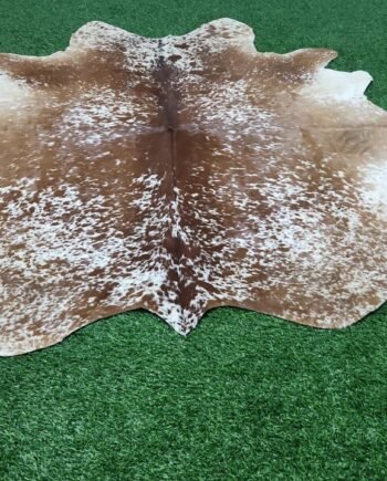 brown white cowhide rug
