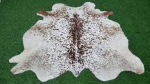 brown white cowhide rug