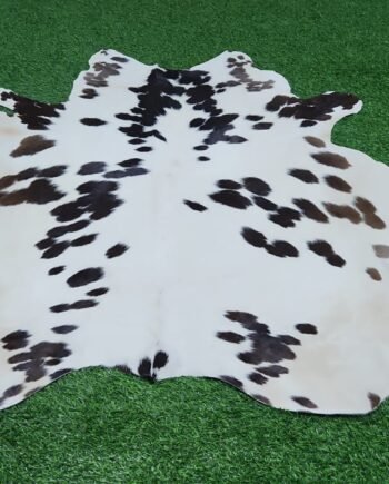 White black brown cowhide rug