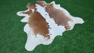 Brown and white cowhide rug