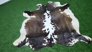 Dark brown and white cowhide rug