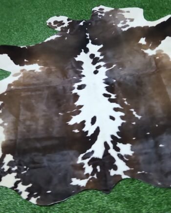 Dark brown and white cowhide rug