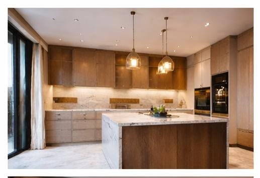 Luxury custom kitchen carpentry in Dubai villa with wooden cabinets and island counter.