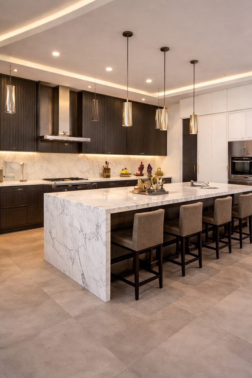 luxury kitchen renovation Dubai with marble island modern cabinets and lighting