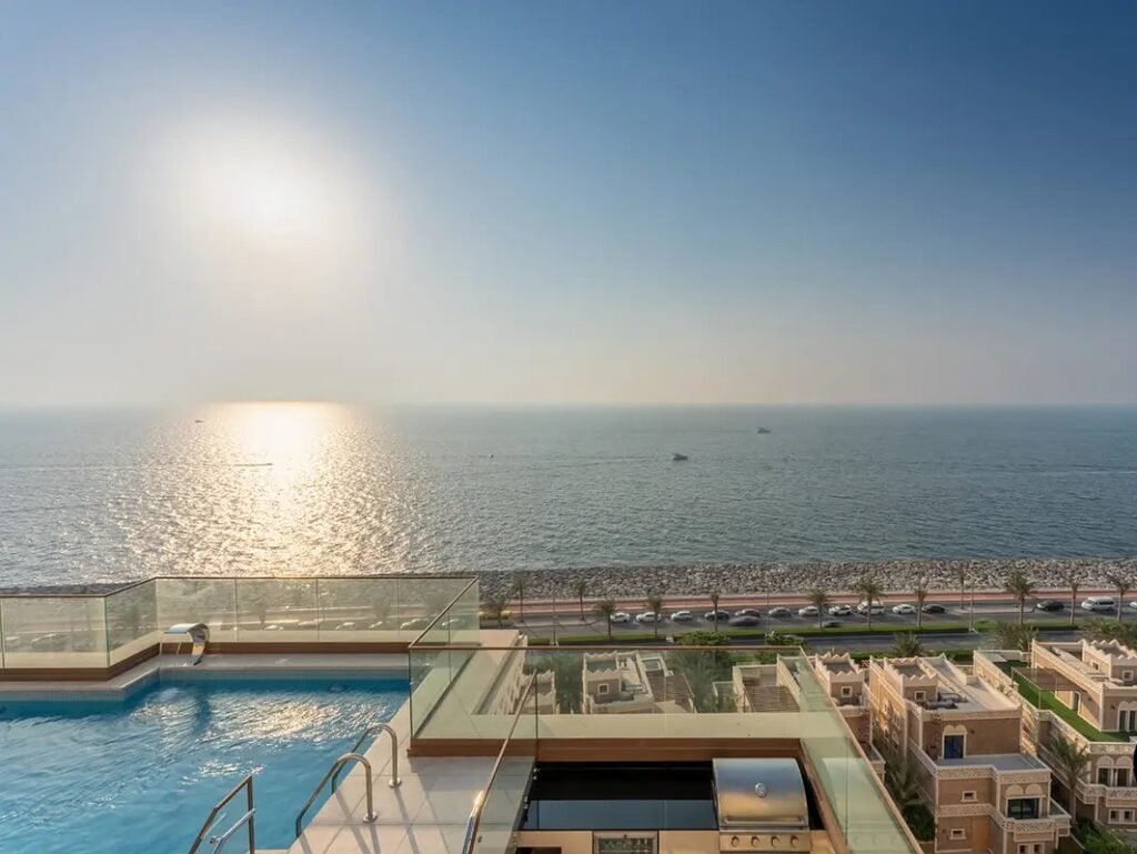 Luxury rooftop swimming pool and outdoor lounge after renovation at Balkis Residence penthouse in Palm Jumeirah Dubai